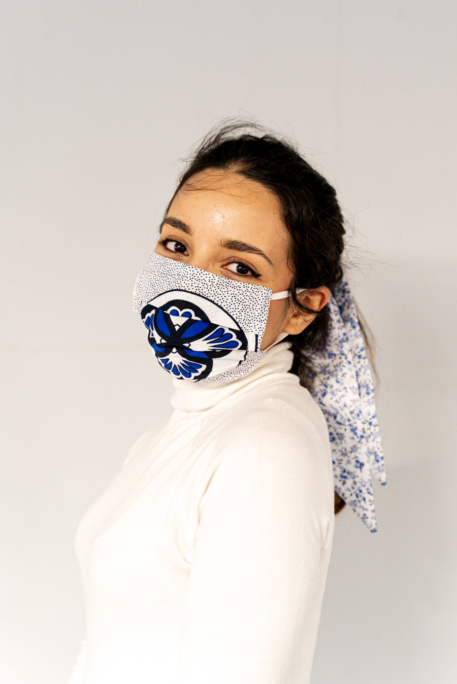 Blue lotus sanitary face mask worn by model